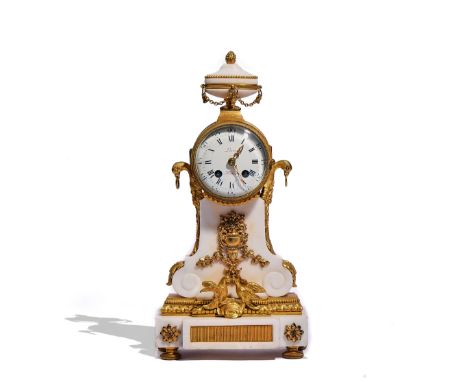 A NAPOLEON III ORMOLU-MOUNTED WHITE MARBLE MANTEL CLOCKIn the Louis XVI style, Circa 1870The case surmounted by an urn, above