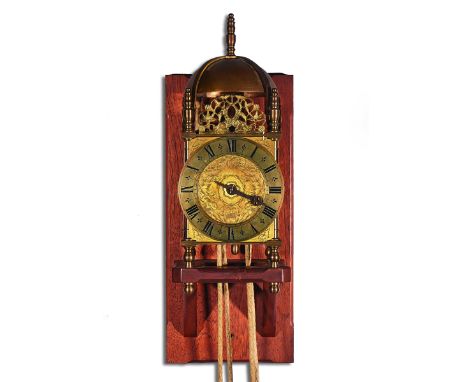 A BRASS VERGE LANTERN CLOCKIn the 17th Century style, modernOf typical form, surmounted by five finials and a bell, above pos