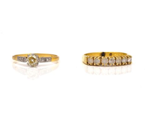 TWO 18CT GOLD AND DIAMOND RINGS (2)Comprising; an 18ct gold ring, claw set with the principal cushion shaped diamond between 