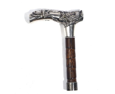 AN ASIAN CANE HANDLEProbably Chinese, circa 1900, of curved form with a dragon motif, monogram engraved to one end, length of