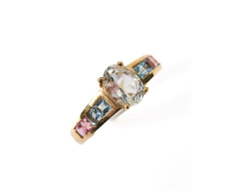 A tourmaline and topaz ring stamped 10K, ring size N/O