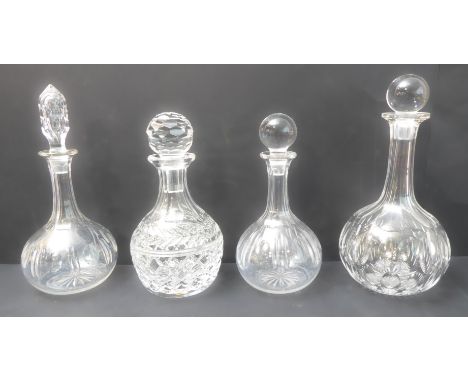 Three hand-cut globe-and-shaft decanters and a smaller hand-cut mallet-shaped decanter (4)