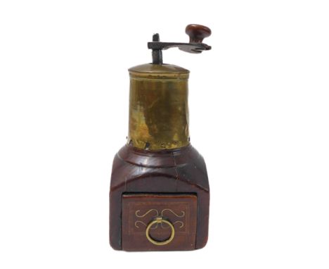A 19th century continental brass-mounted mahogany coffee grinder: brass-inlaid drawer and sides, iron turning handle with pat