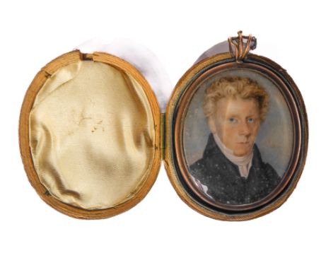 An early to mid 19th century unsigned portrait miniature on ivory: a young blue-eyed gentleman in black frock-coat (approx. 6