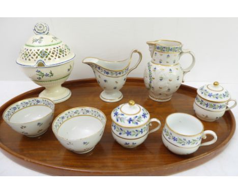 Eight pieces of late 18th century English pottery ceramics:a creamware server with ladle aperture, the finial as an angled fl