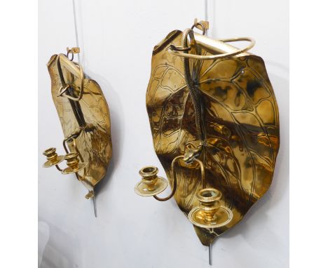 An unusual pair of late 19th century two-light brass wall sconces in Arts and Crafts style: each with a central serpent holdi