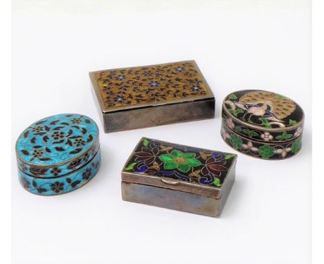 Four white-metal and enamel boxes:two oval examples (aprrox. 4 x 3.3 x 1.8 cm) one decorated with a peacock fanning his tailf