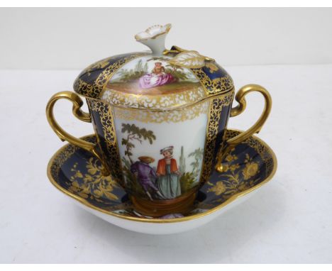 A late 19th century Dresden two-handled chocolate cup and cover with original conforming stand, each piece typically gilded a