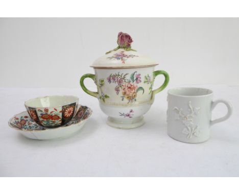 A collection of three pieces of 18th century porcelain comprisingan English Bow 'blanc de chine' coffee can with raised prunu