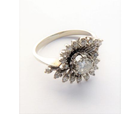 A diamond-set ring, the central brilliant-cut diamond estimated to spread 0.20-0.25-carats coronet-set to either side with a 