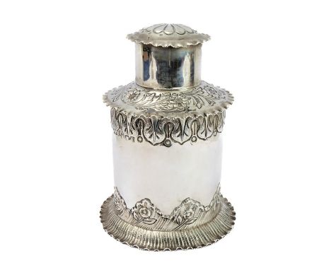 An early 20th century tea caddy of cylindrical form by Mappin &amp; Webb: the cover decorated&nbsp;repoussé style with a flow