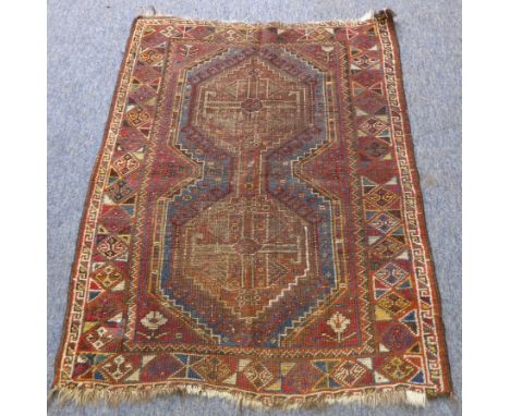 A South-West Persian&nbsp;Shiraz carpet:&nbsp; two lozenges against a red ground and light blue border (very worn) (116cm x 8