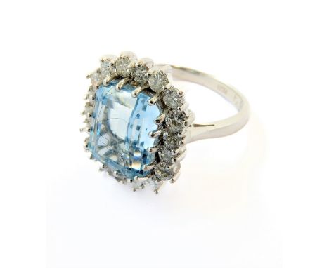 An aquamarine and diamond-set cluster ring, the rectangular cut-cornered step-cut aquamarine claw-set above a surround of bri