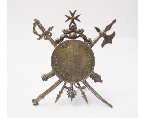 A 1796 silver 2 scudi piece mounted in a white-metal easel-frame in the form of a crossed sword and halberd and with Maltese 