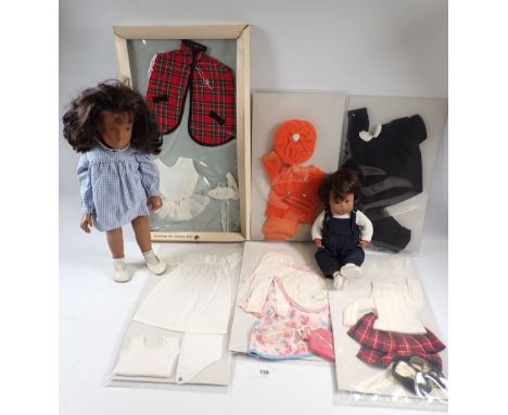 A vintage Sasha brunette doll in gingham dress, a baby Sasha doll in dungarees plus a collection of clothing including a Sash
