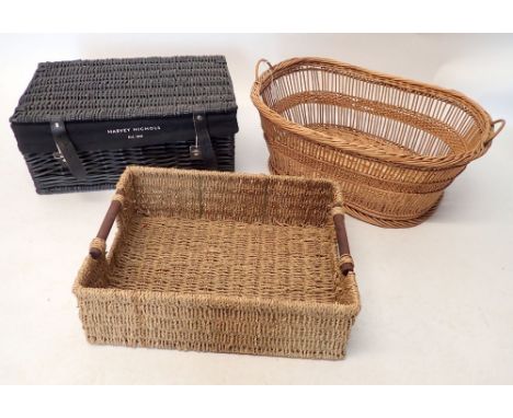 A Harvey Nichols black wicker hamper and two baskets 