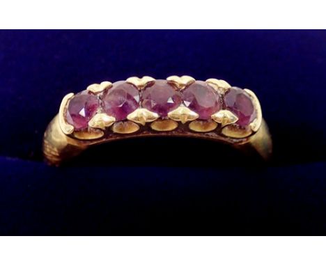 An 18 carat gold ring set five amethysts, 6.4g, size K to L