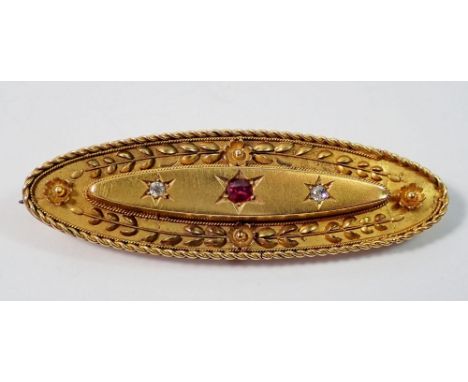 A Victorian 15 carat gold oval brooch set ruby and two diamonds, 4g, 5cm