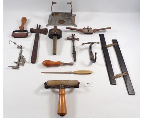 A box of collectable tools including two hatchet hammer axe multi tools, printing rollers etc.