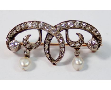 A gold brooch set diamonds with pearl drops in fitted case, 3cm wide