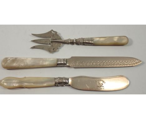 A mother of pearl handled silver cake knife and fork and butter knife, all hallmarked