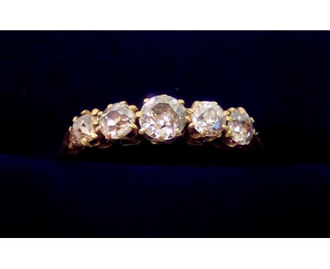 An 18 carat gold ring set five graduated diamonds, size K, 2.2g