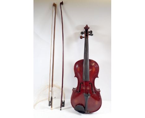 An early 20th century Stainer violin stamped Stainer Made in Saxony, 14" back, in fitted mahogany case with two bows