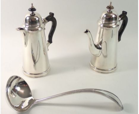 A pair of silver plated coffee pots, 21cm tall and a silver plated ladle
