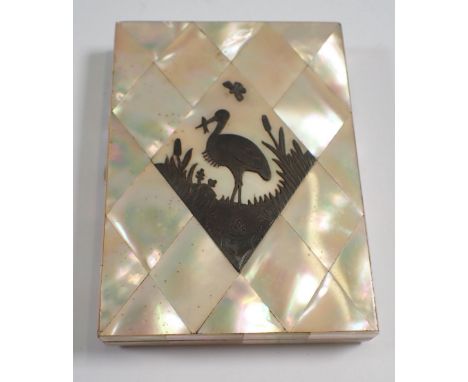 A Victorian mother of pearl card case inset with white metal stork 