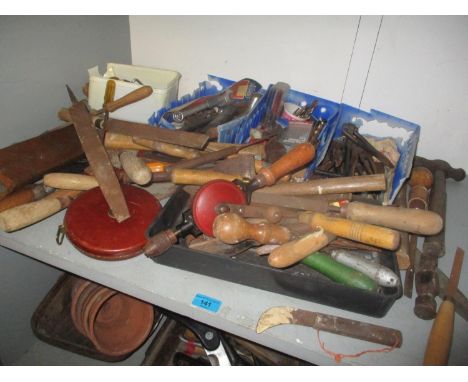 A mixed lot of tools to include chisels, tape measure, spanners, hammer and other items 