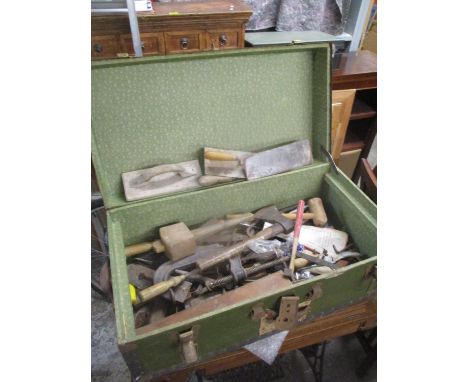 A vintage twin handled metal bound trunk containing mixed tools 