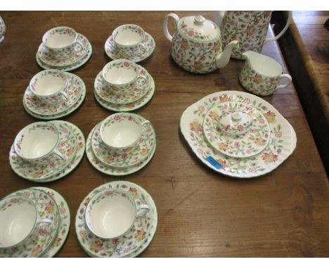 A Minton Haddon Hall part tea service comprising eight tea cups, saucers and nine cake plates, a tea pot, coffee pot, sandwic