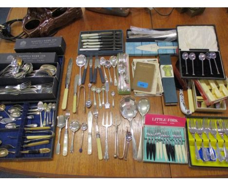 A quantity of flatware and cutlery to include Mappin &amp; Webb silver plated spoons and forks, together with cake knives and