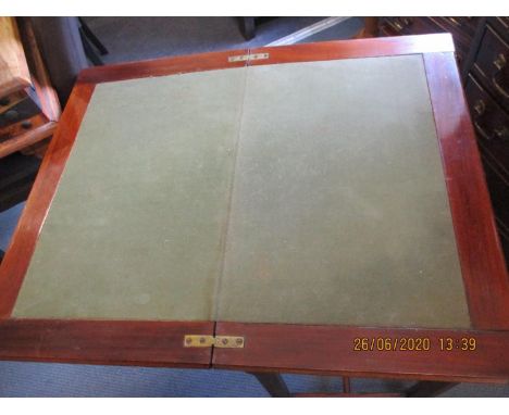 A 20th century mahogany card table with rotating foldover top 