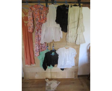 A quantity of 20th century ladies clothing to include early 20th century black lace blouse, all requiring seamstress attentio