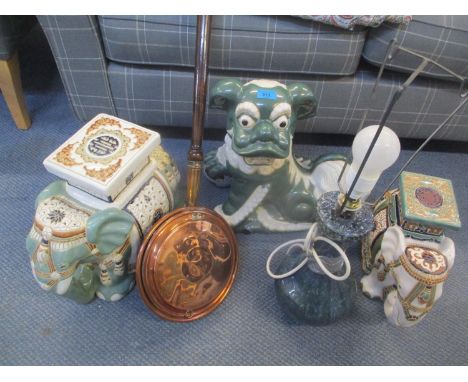 Two low elephant porcelain seats, together with an ornament of a Chinese dragon, a warming pan and a table lamp 