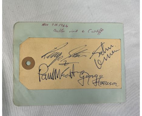 THE BEATLES - "A Ticket to Ride!", a group of the Fab Fours autographs on a Manila card luggage tag (laid to album page). An 