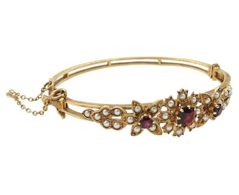9ct gold garnet and split pearl flower design hinged bangle by Zeeta, stamped 9ctCondition Report:Approx 16.7gm, inner circum
