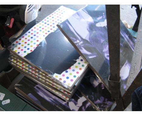 A box of Boyz Toyz pop art prints on boards 