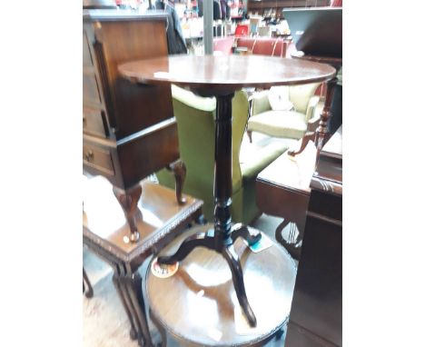 A mahogany tripod table 