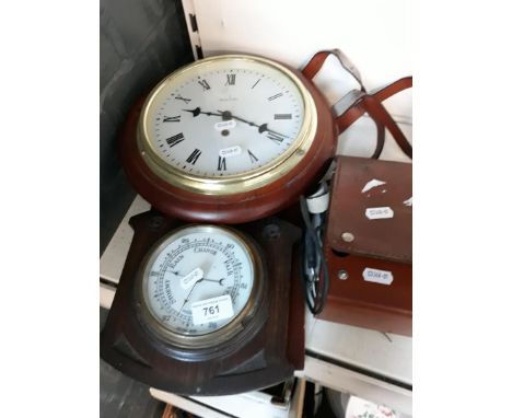 A barometer, a clock and an Insulation and Continuity tester 