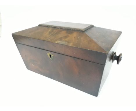 A Regency mahogany tea caddy of sarcophagus form, length 33cm, as found. 