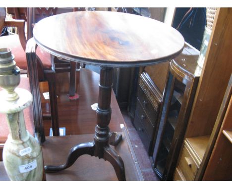 A mahogany tripod table 