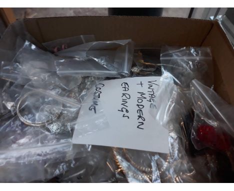A box of vintage and modern earrings 