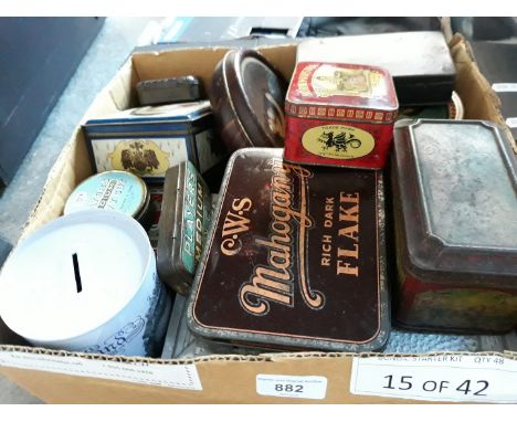 A box of vintage advertising tins 