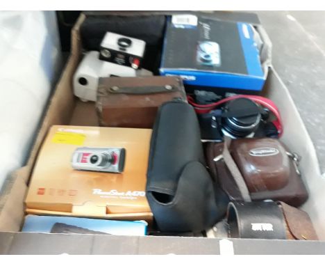 A box of modern and vintage cameras including Pentax 