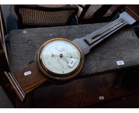 An oak cased barometer 
