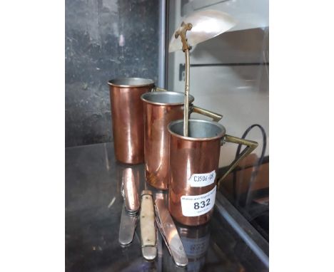 Three small copper measures, a ladle and some penknives 