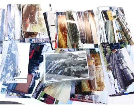 A box of railway engine photos approx. 69 black and white steam and approx. 100 colour diesel. 