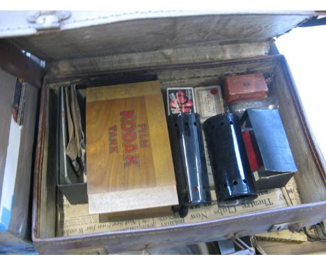 A vintage suitcase of film developing items 